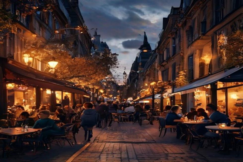 Cena de rua em Londres à noite, com cafés e iluminação acolhedora.