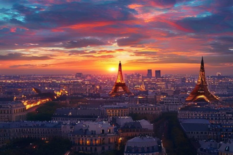 Skyline of Paris with illuminated landmarks at sunset.