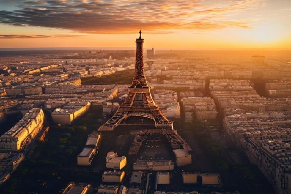 Vista aérea de Paris com a Torre Eiffel ao pôr do sol, simbolizando aventura e beleza.